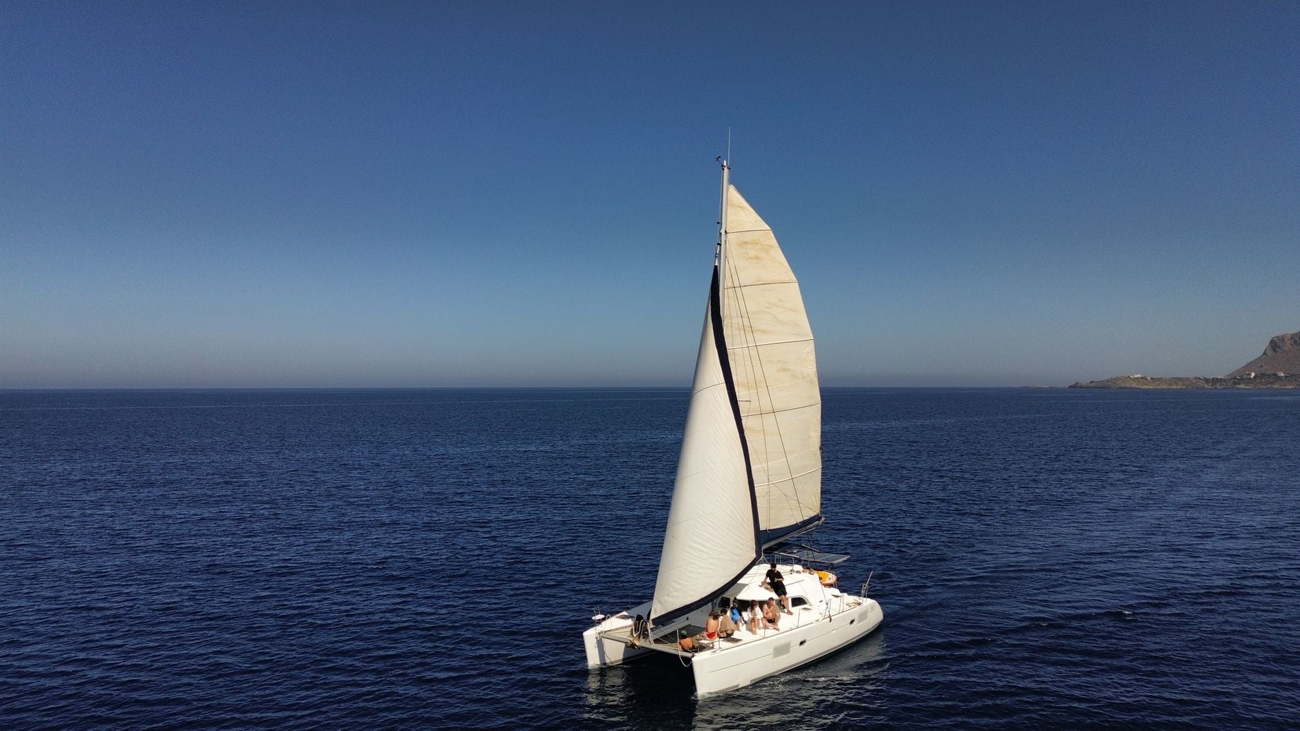 Bellwether under sail on the open channel