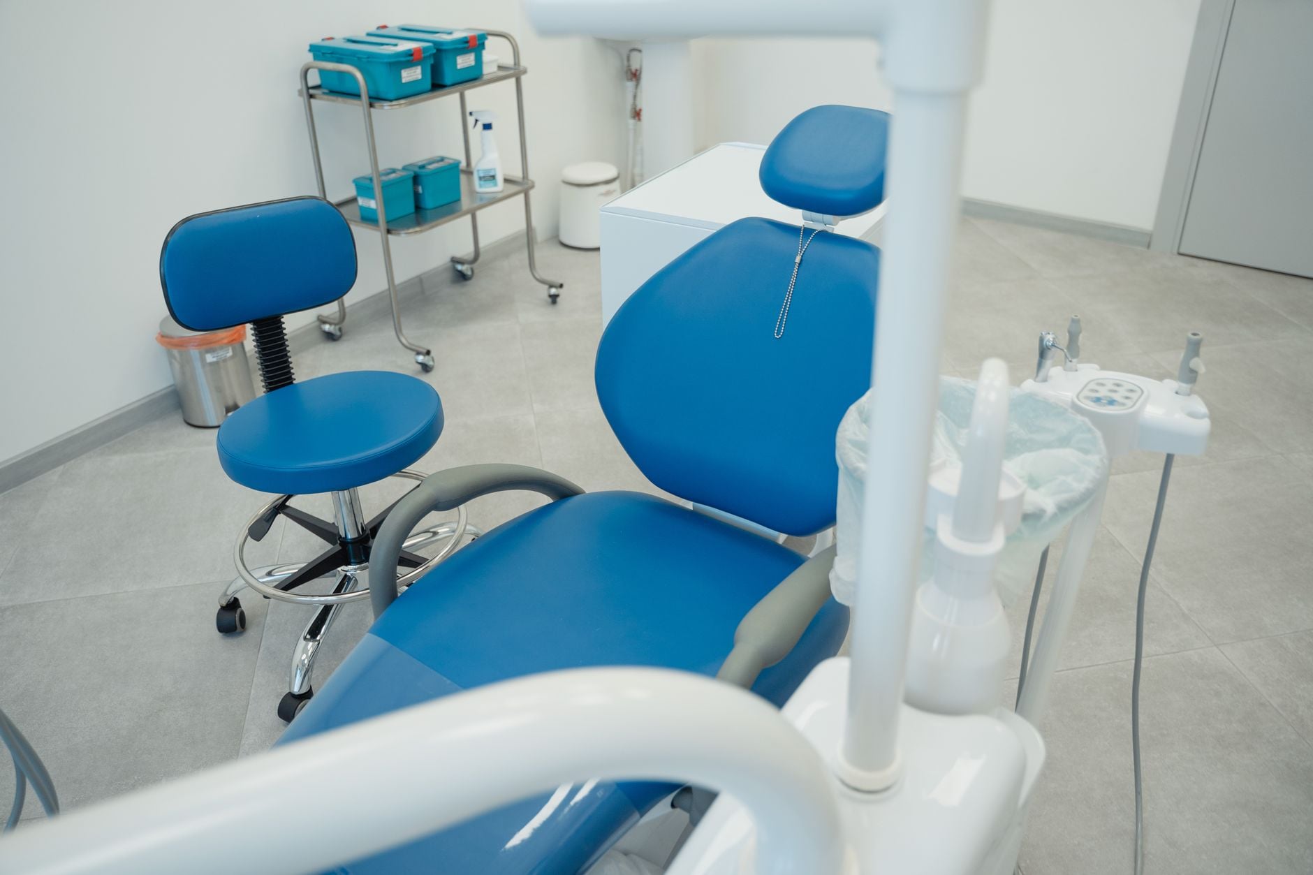 A dental operatory — the chair, the light, the tray