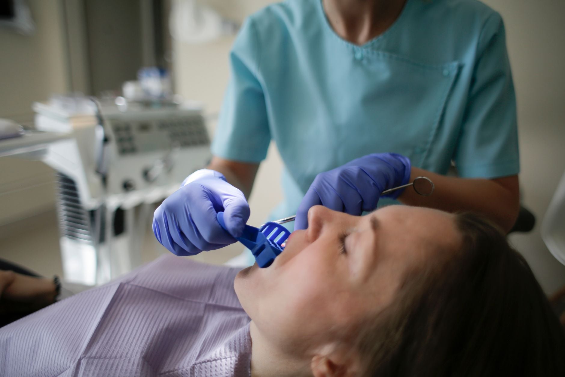Gloved hands at work over a patient