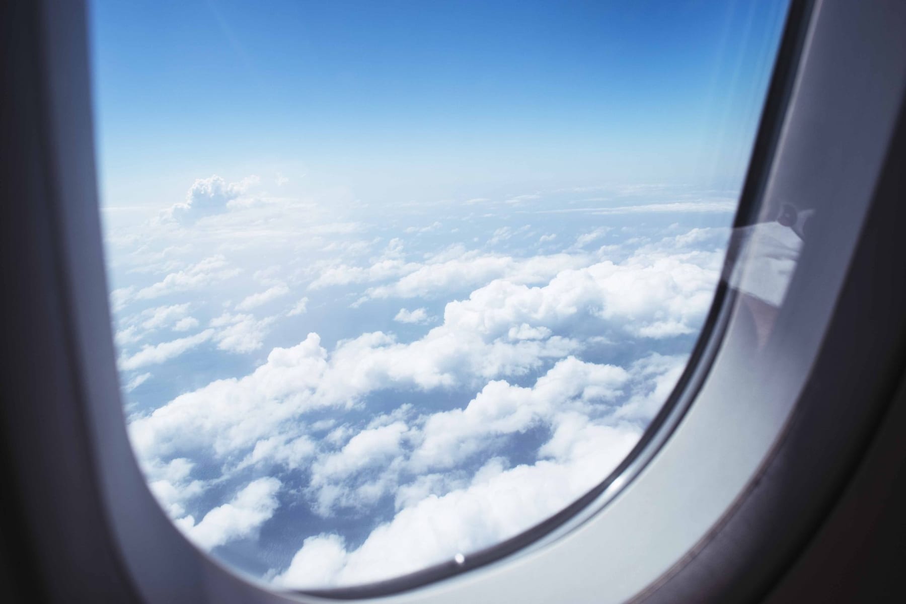 A sea of cloud from a jet window at altitude