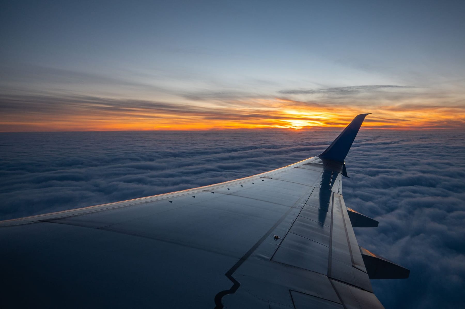 A jet wing over cloud, winglet raked up