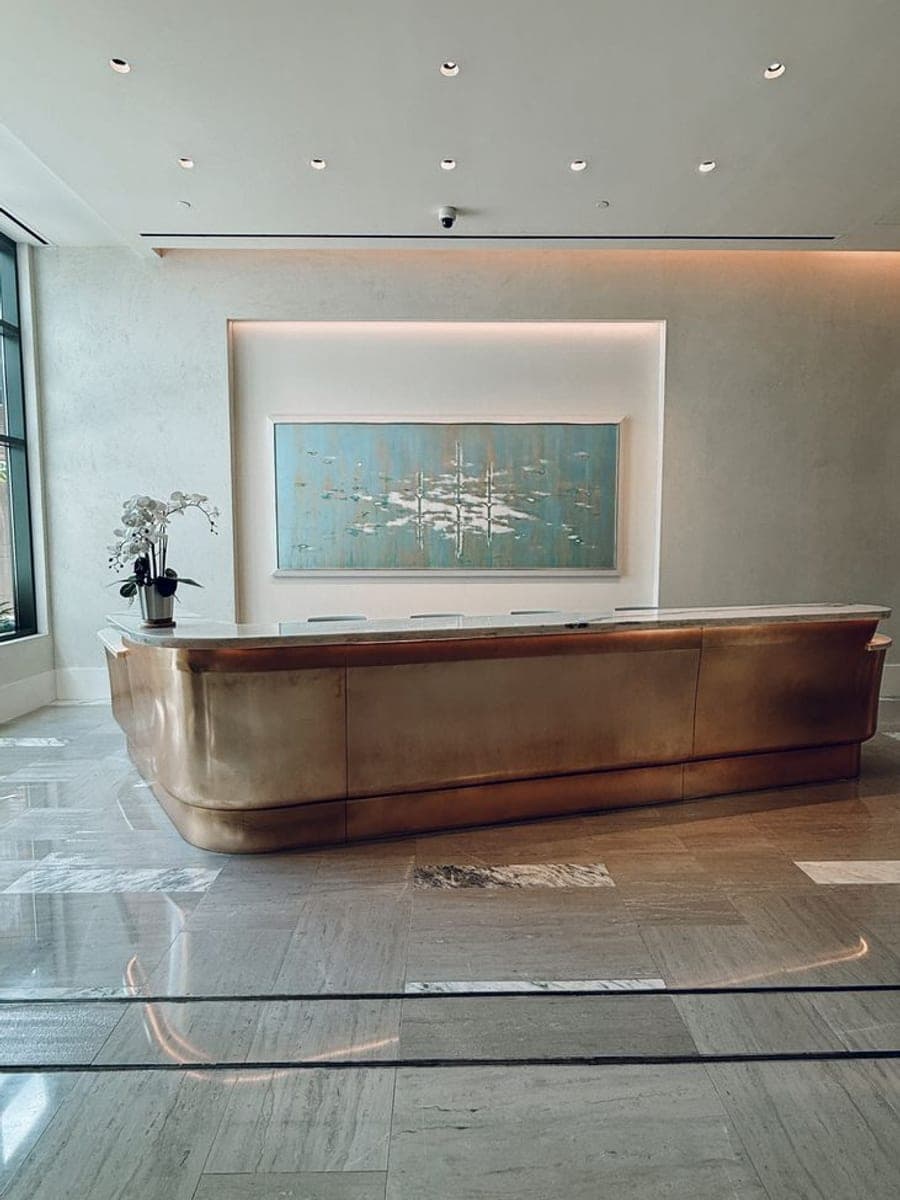 A reception desk in an office lobby